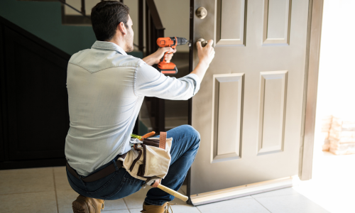 Man installing a door lock